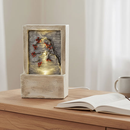 DekoSturm beige polyresin water feature with warm white LED lights and red berries on a branch, 23x9.5x15cm.