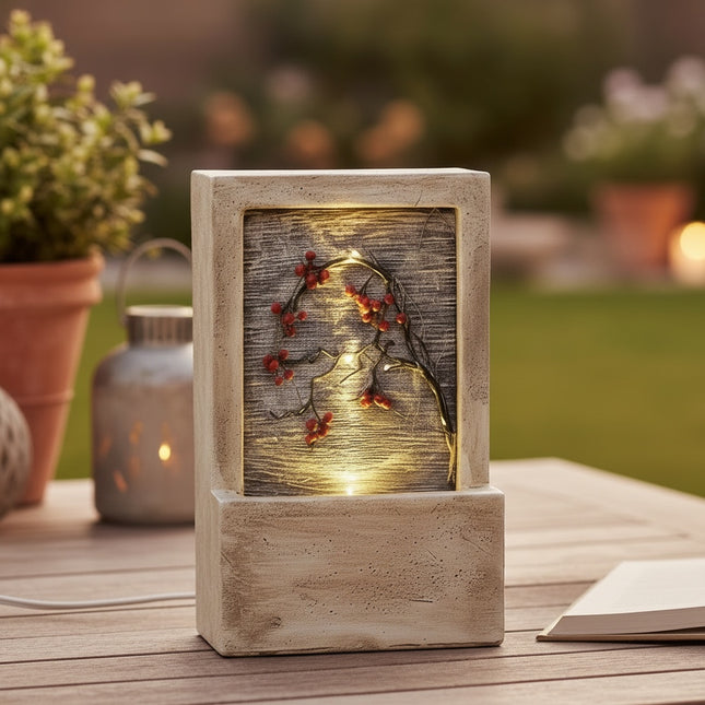 DekoSturm beige polyresin water feature with warm white LED lights and red berries, 23x9.5x15cm, suitable for outdoor use.