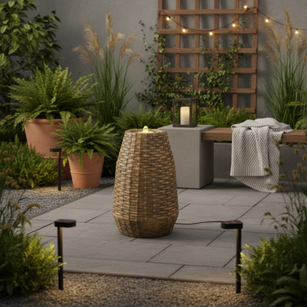 DekoSturm Lumineo LED garden fountain with a wicker texture finish and warm white lighting, suitable for outdoor use.